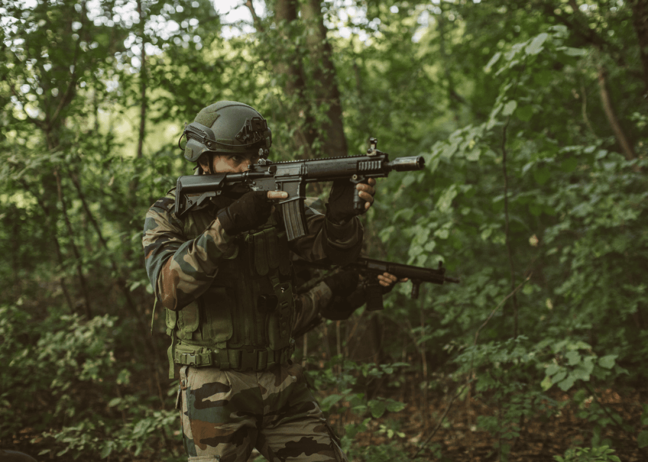 Armed soldiers doing military training.