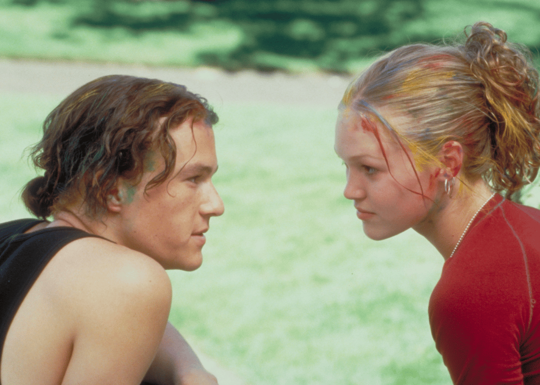 A young man and woman stare longingly at one another.