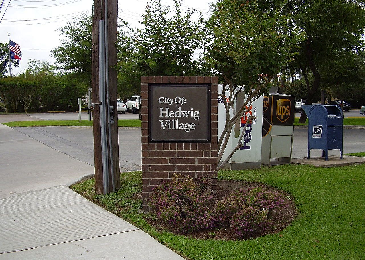 A brick Hedwig Village sign.