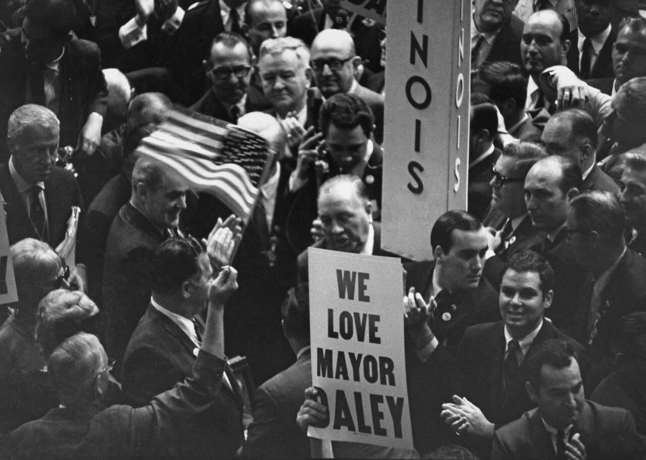 Illinois delegates holding a banner promoting Chicago's Mayor Richard Daley on the convention floor of the final day of the 1968 DNC.