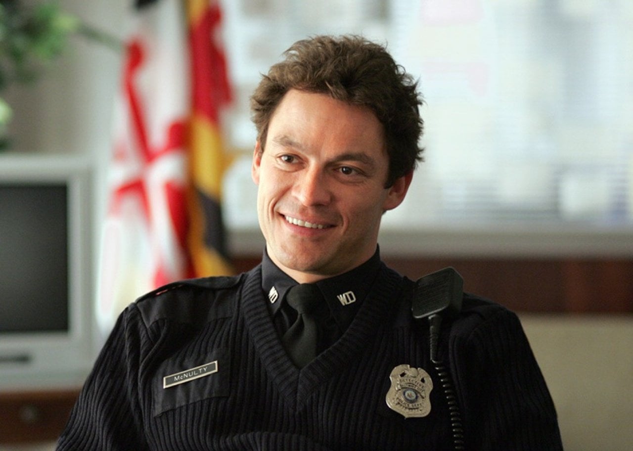 Dominic West in a dark police uniform.
