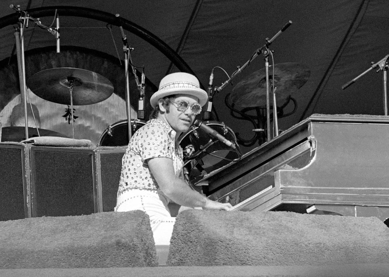  Elton John performs on stage during the West of the Rockies tour.