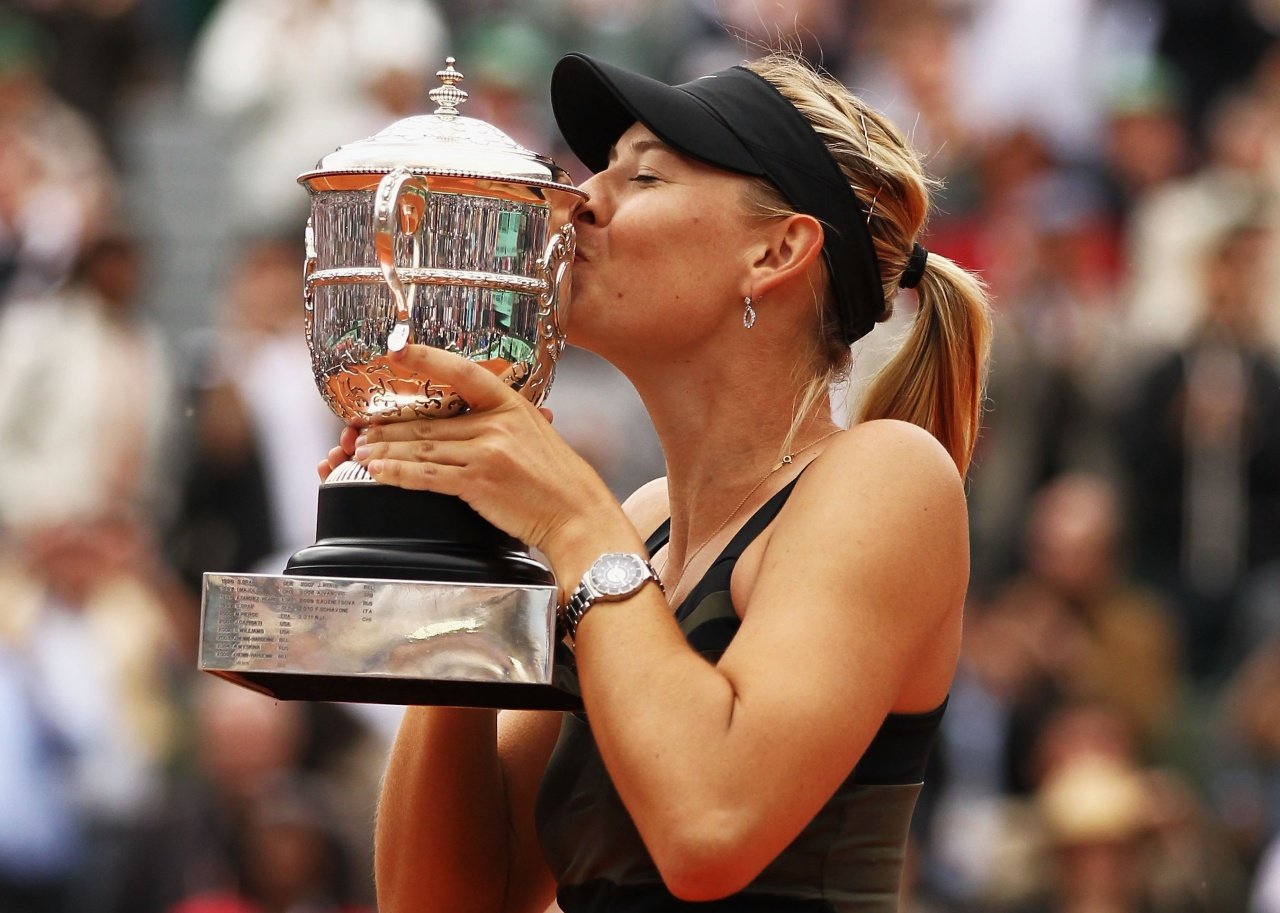 Maria Sharapova of Russia kisses the Coupe Suzanne Lenglen