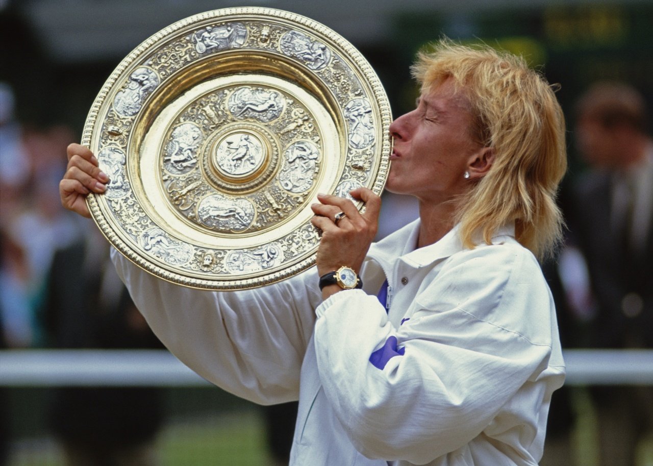 Martina Navratilova of the United States kisses the Venus Rosewater Dish