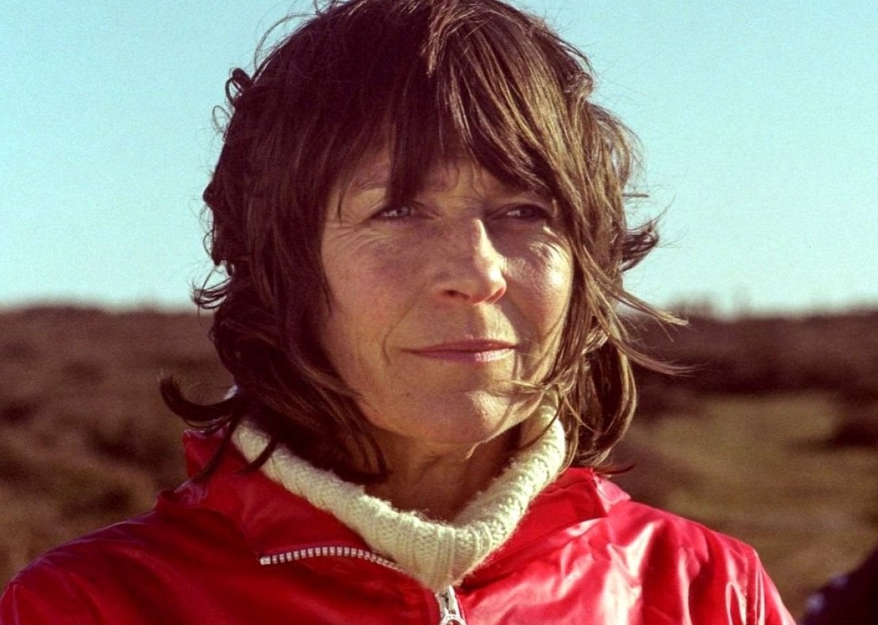 A woman in a red coat.