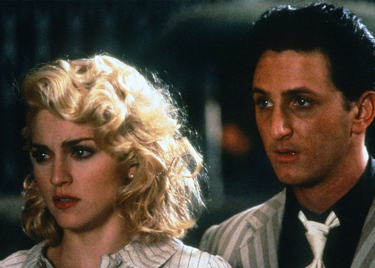 Madonna and Sean Penn with serious looks on their faces.
