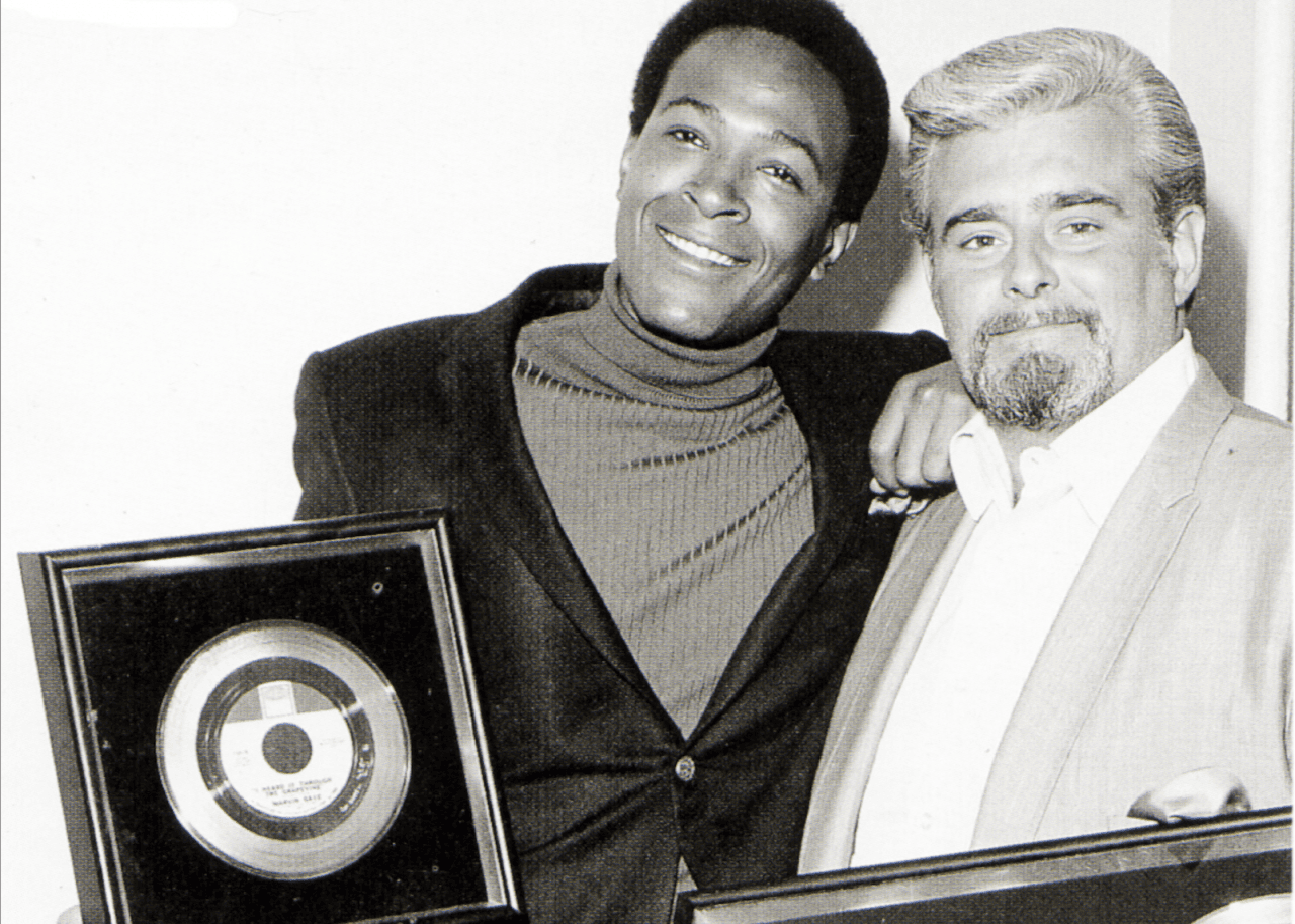 Marvin Gaye with Barney Ales of Motown with gold discs of single 'I Heard It Through The Grapevine'
