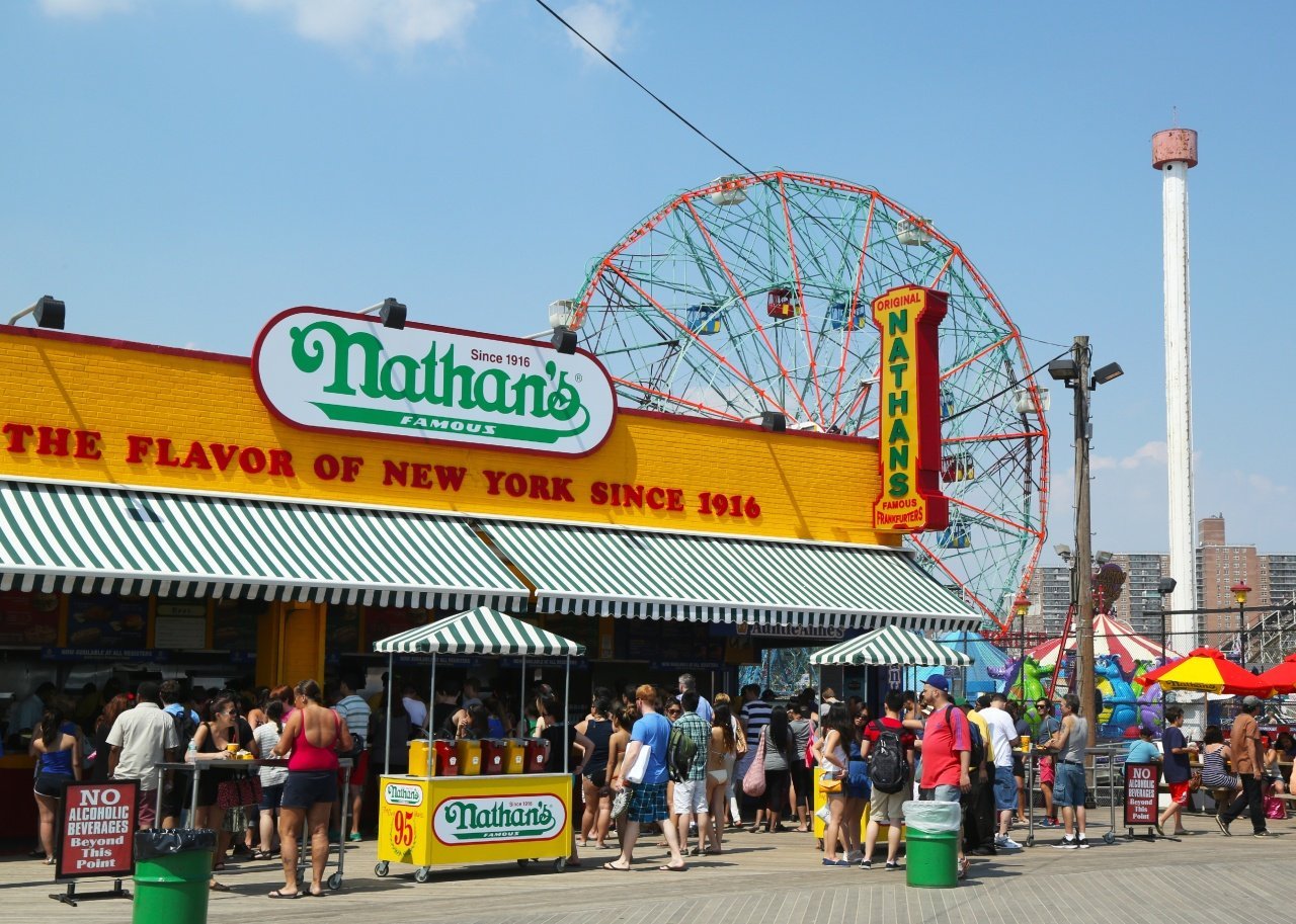 The original Nathan's on the Coney Island Boardwalk, busy with patrons.