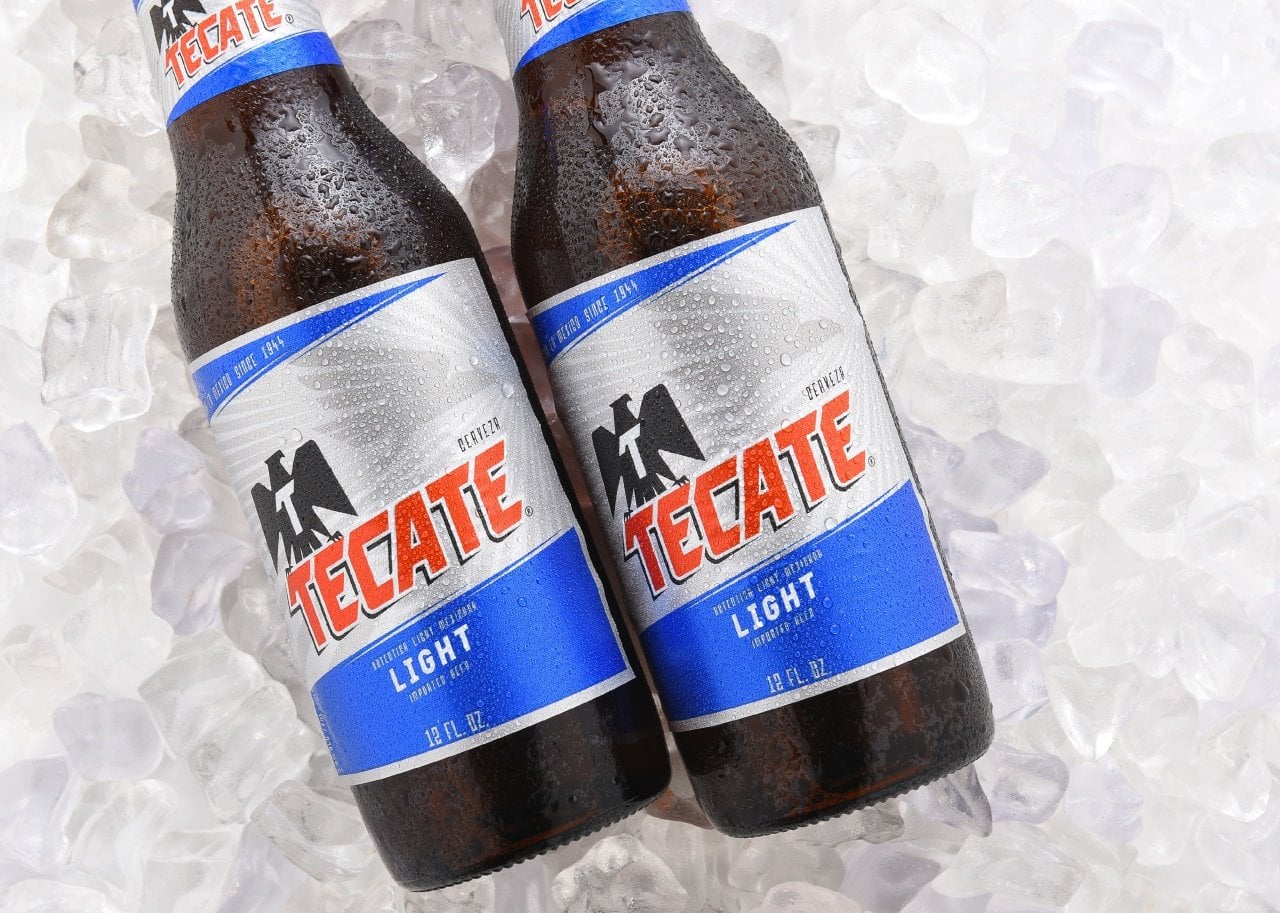 Tecate Light bottles on ice