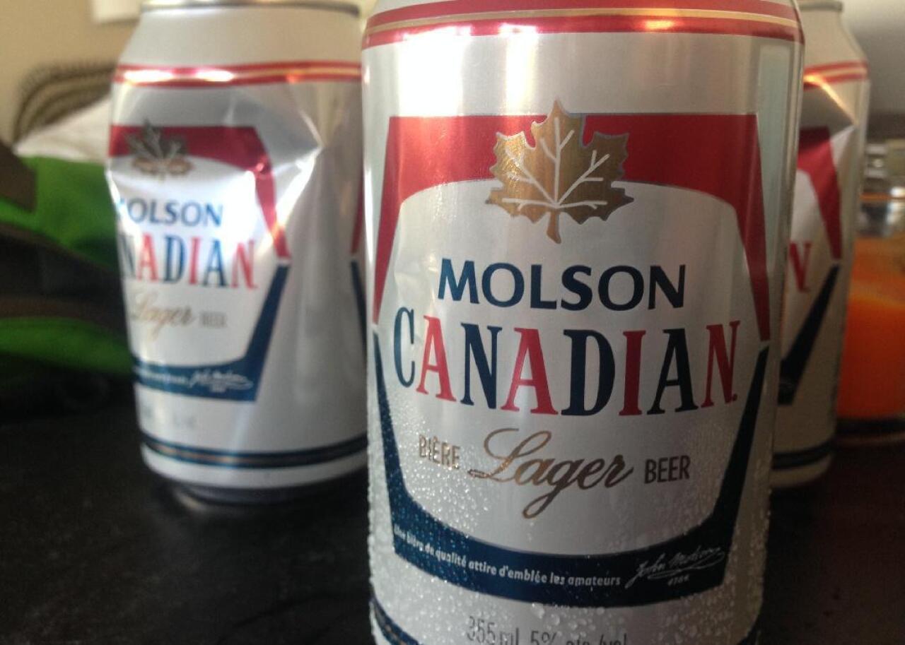 Two cans of Molson Canadian beer.