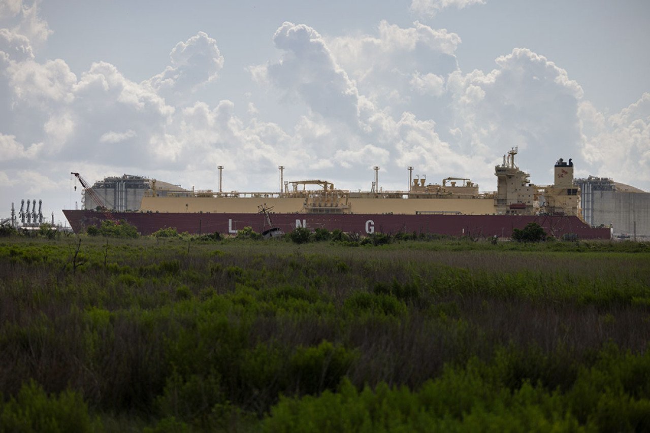 A tanker designed to export liquefied natural gas around the world passes the Calcasieu Pass export terminal In Louisiana. 