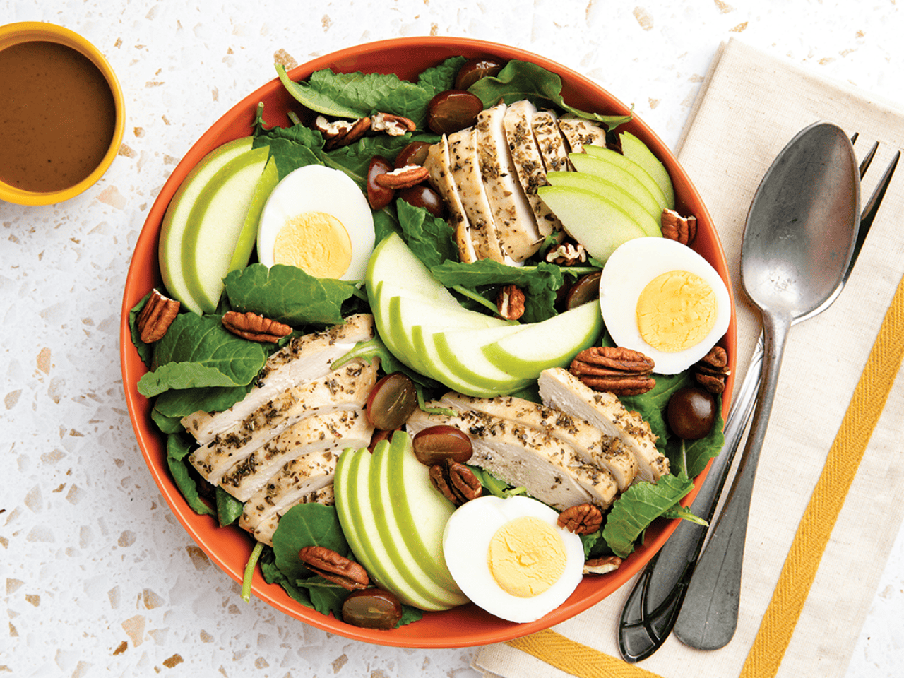 Kale salad with herb-roasted chicken.