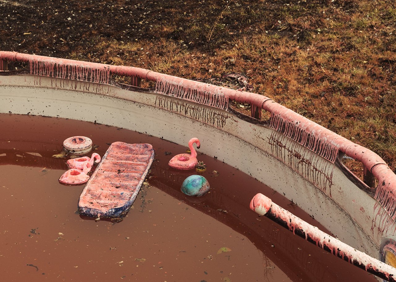 Fire retardant Phos-Check is seen over a burnt inflatable pool.