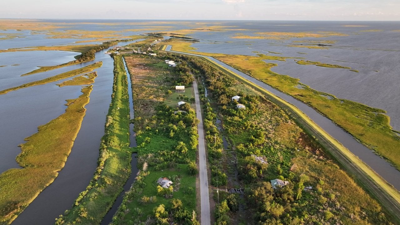 Aerial view of storm-damaged and abandoned homes are seen on Isle de Jean Charles, Louisiana. in 2025. The island community is so vulnerable to sea level rise, it became the site of the first fully federally funded climate-driven relocation project in the nation.