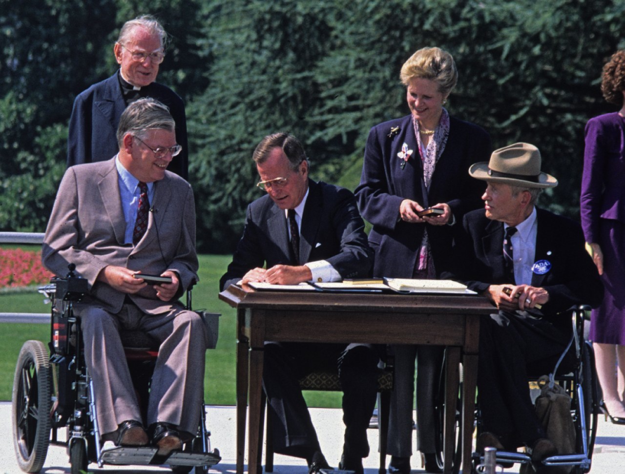 President George Bush signing the Americans with Disabilities Act of 1990