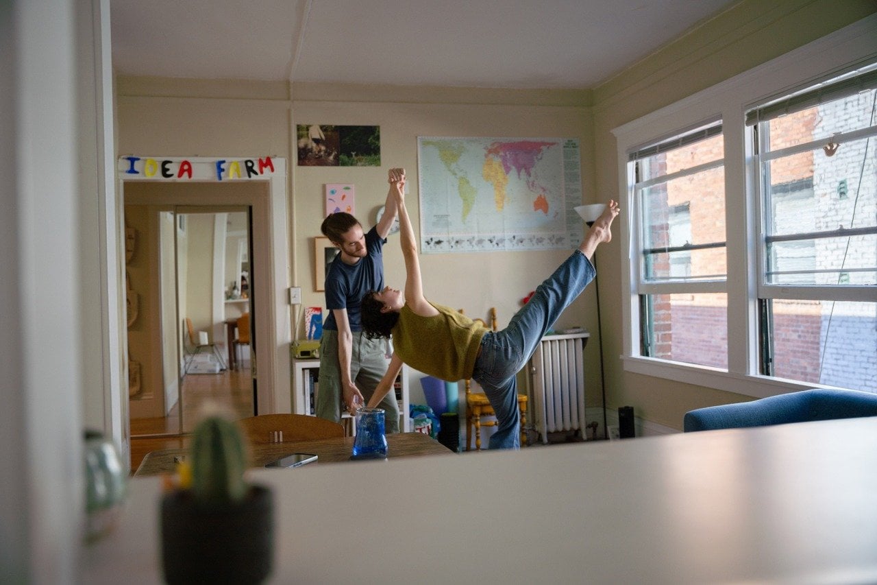 Henry Winslow, left, and Emma Andre rehearse a dance routine in their home in Oakland.