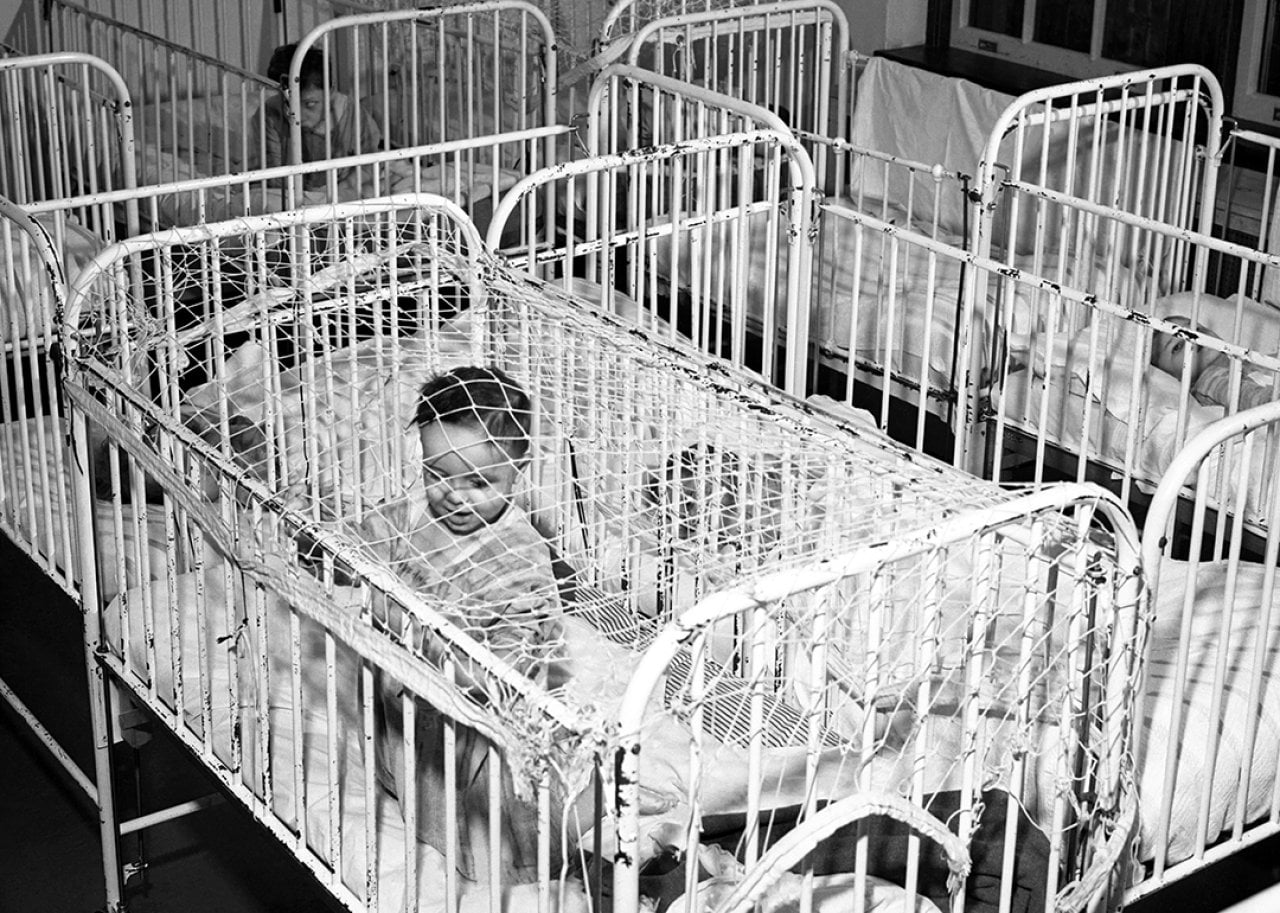 Babies and young children are confined in their cribs, circa 1946 at Letchworth Village in New York, New York.