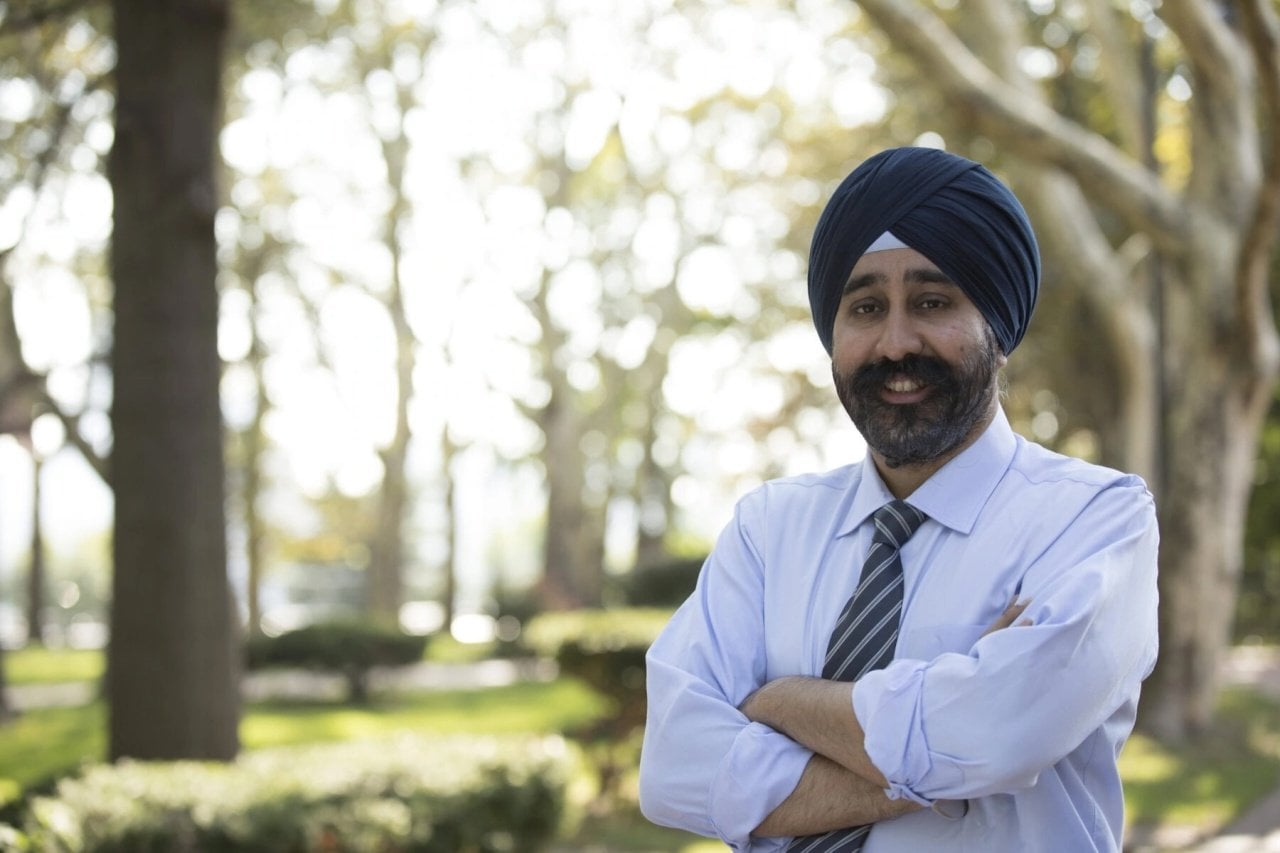 Mayor Ravi Bhalla wearing a tie and blue shirt and a navy blue turban.