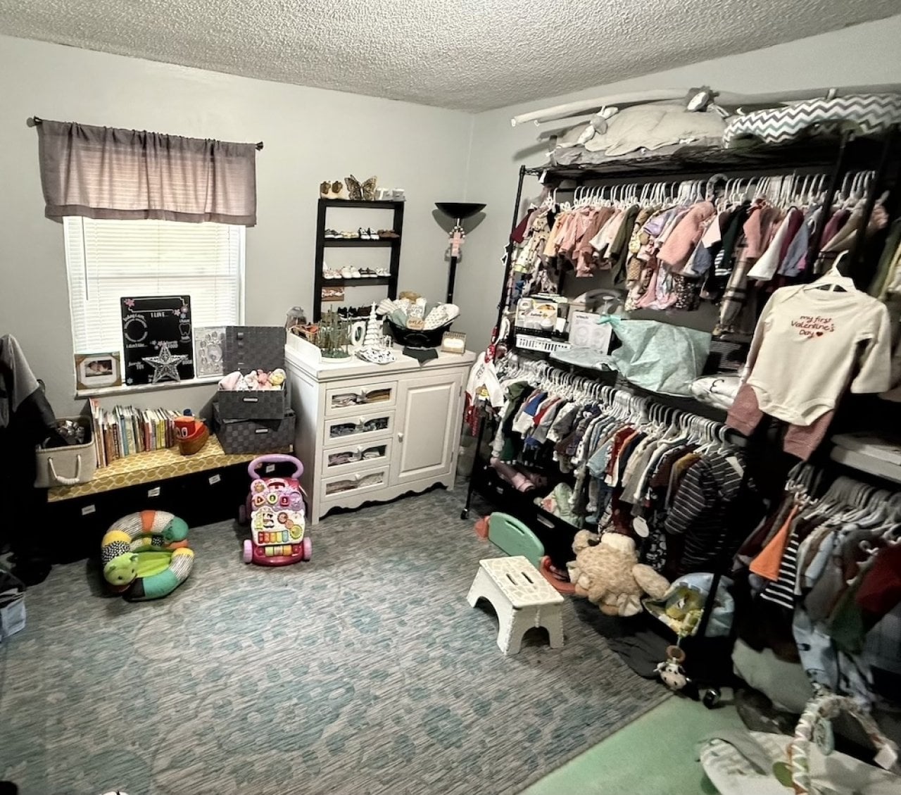 A crisis pregnancy center room where clothing, diapers, strollers, toys and other items are stored as part of the help for women through health and financial crises.