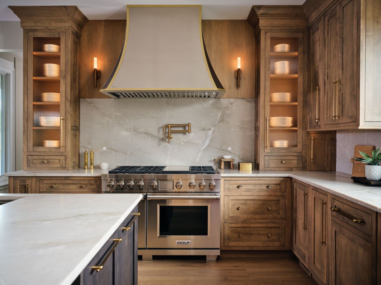 Modern luxury kitchen with interior cabinet lighting.