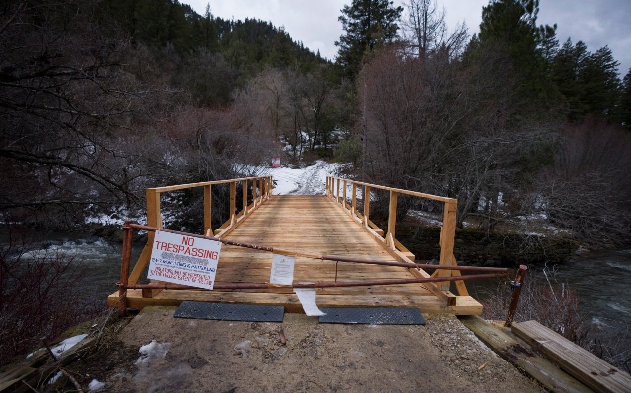 A sign and a gate block a bridge to what was once St. Ann's Retreat, Wednesday, Feb. 25, 2026.