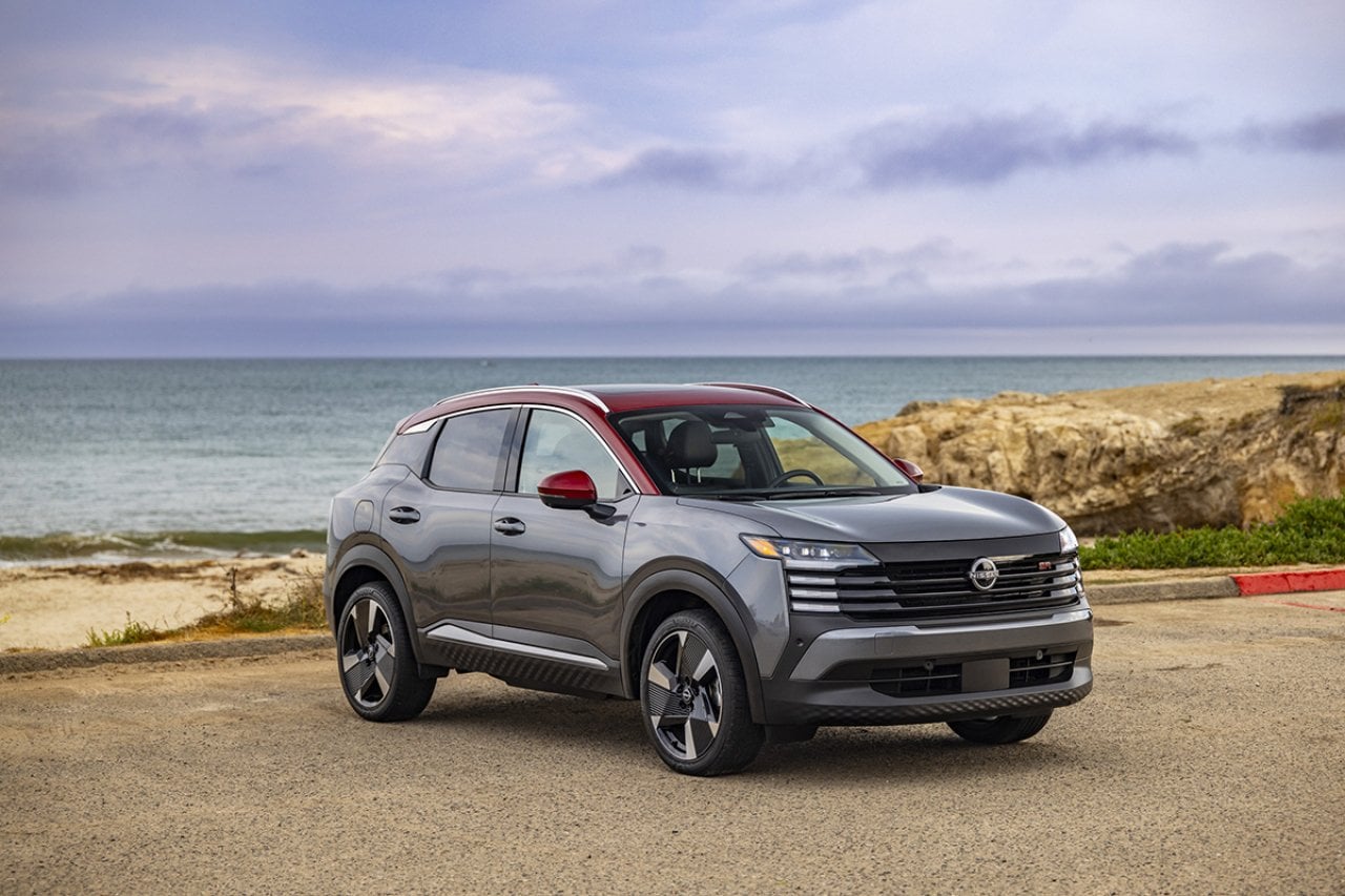 A 2026 Nissan Kicks car parked by the seaside.
