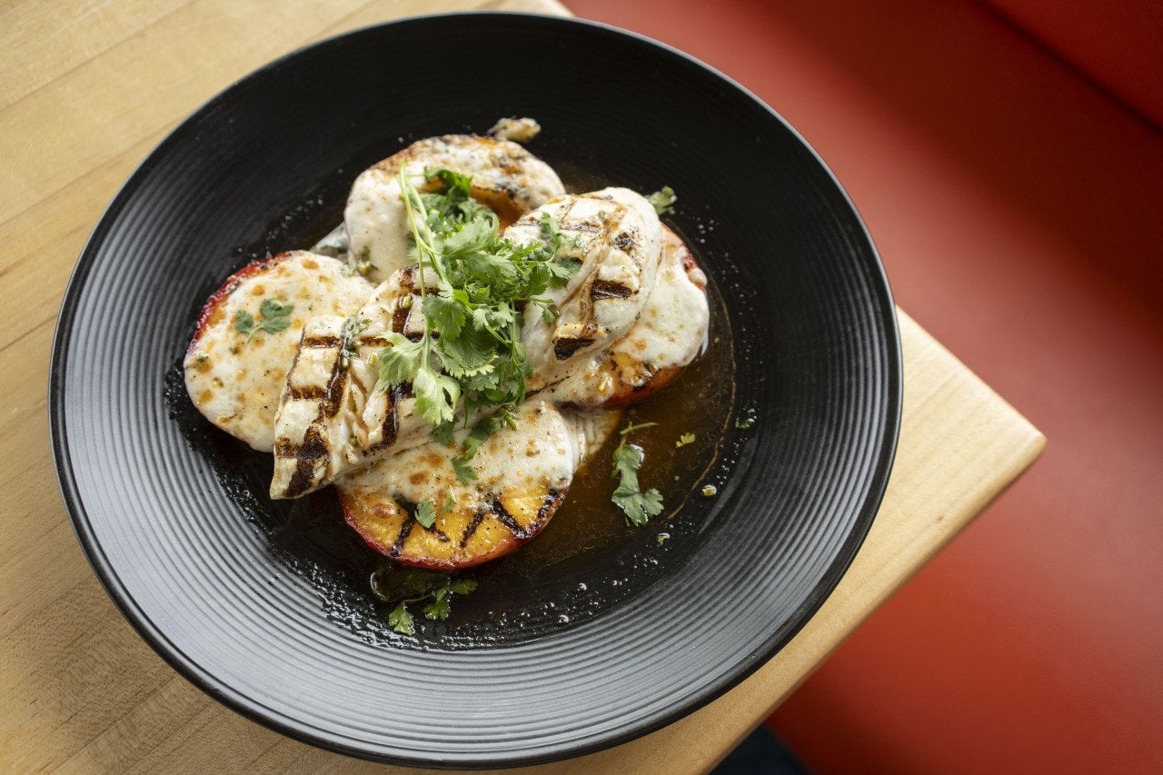 A summertime favorite, halibut and peaches, celebrates local, seasonal halibut, and Pacific Northwest peaches.