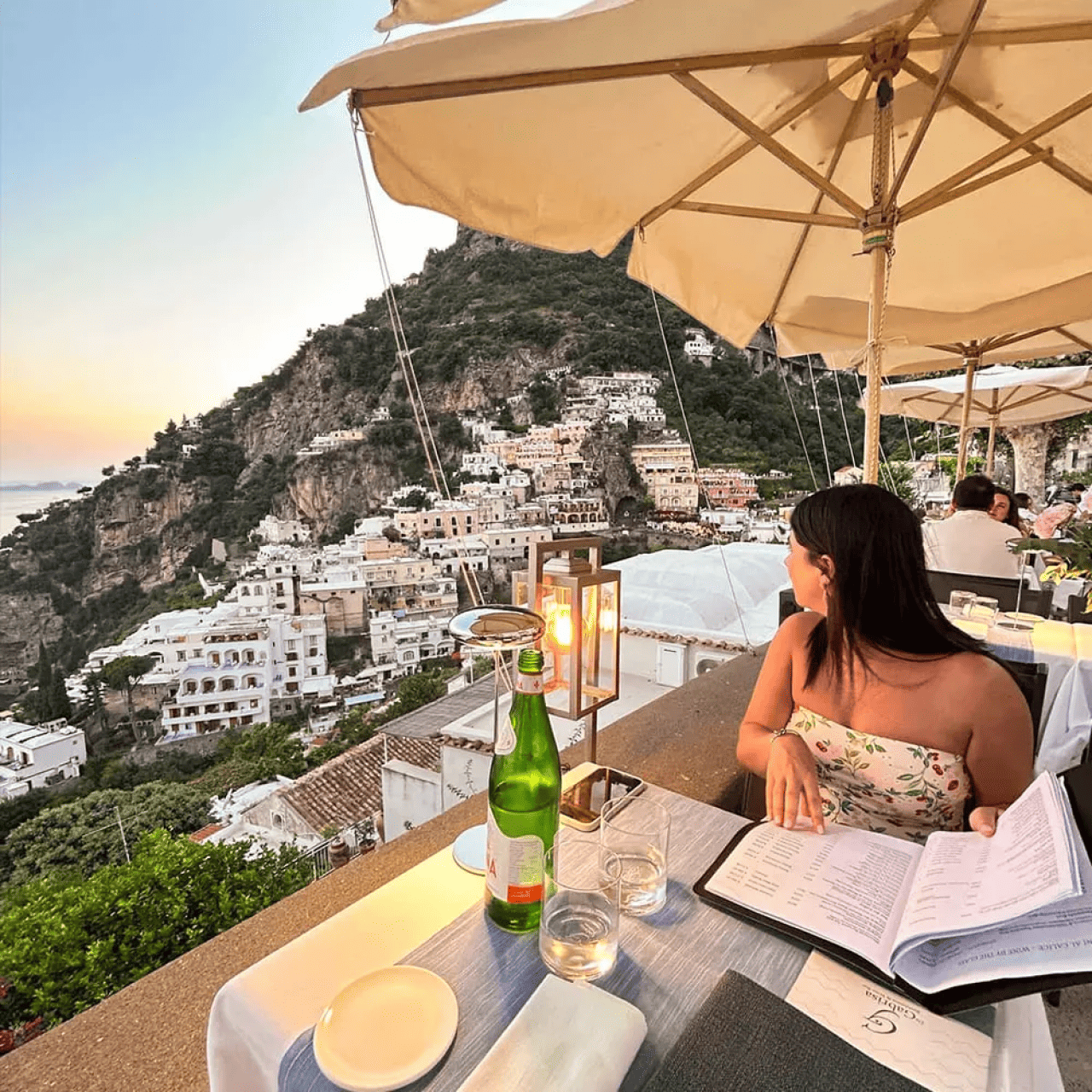 A stunning view of the Amalfi Coast and sunset from a restaurant in Italy.