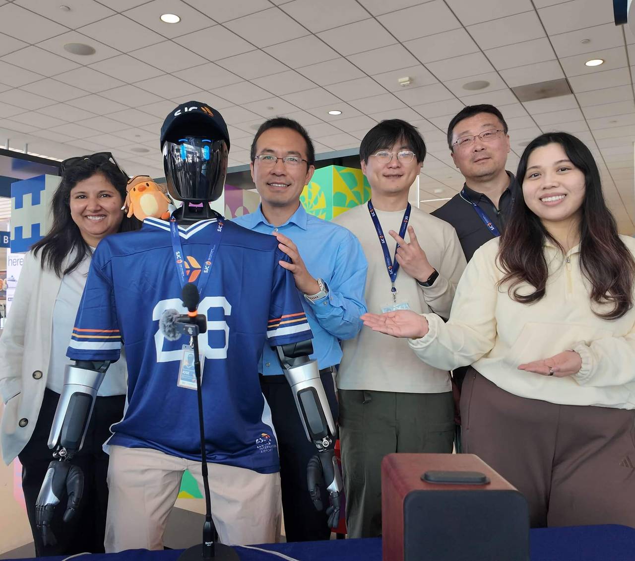 José, a humanoid robot, with the other staff members at San José Mineta International Airport’s Terminal B in California.