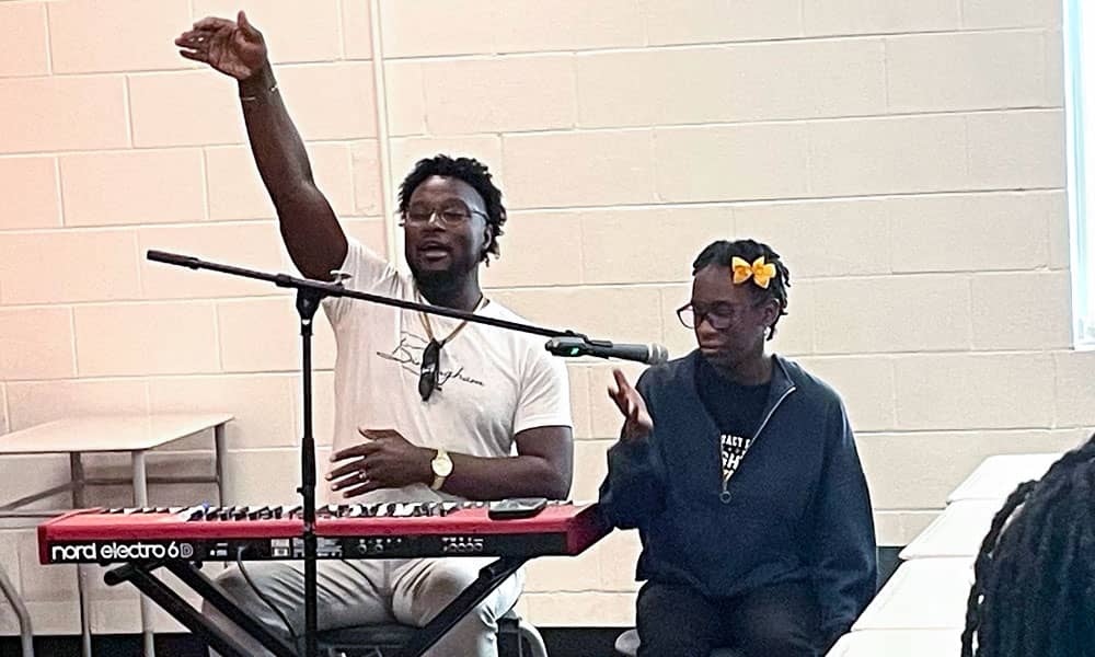 Legacy Prep student Malaysia Speight sang with local recording artist Jarvis Halsey during the school’s “Lights, Camera, Action” summer program.
