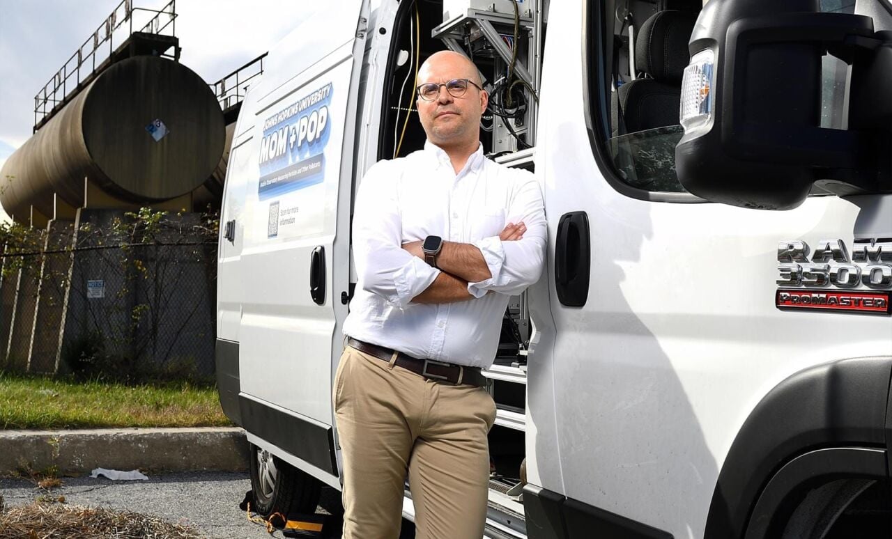 Peter DeCarlo poses with the mobile laboratory used to measure air pollution that he and other Johns Hopkins University researchers drove through Louisiana’s industrial corridor. They discovered that cancer risks from toxic emissions far exceeded EPA figures in some areas.