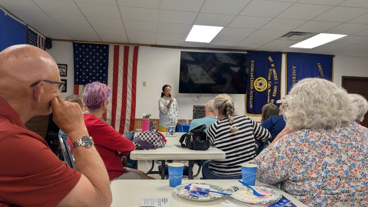 Hong speaks at a meeting of the Polk County Democratic Party.