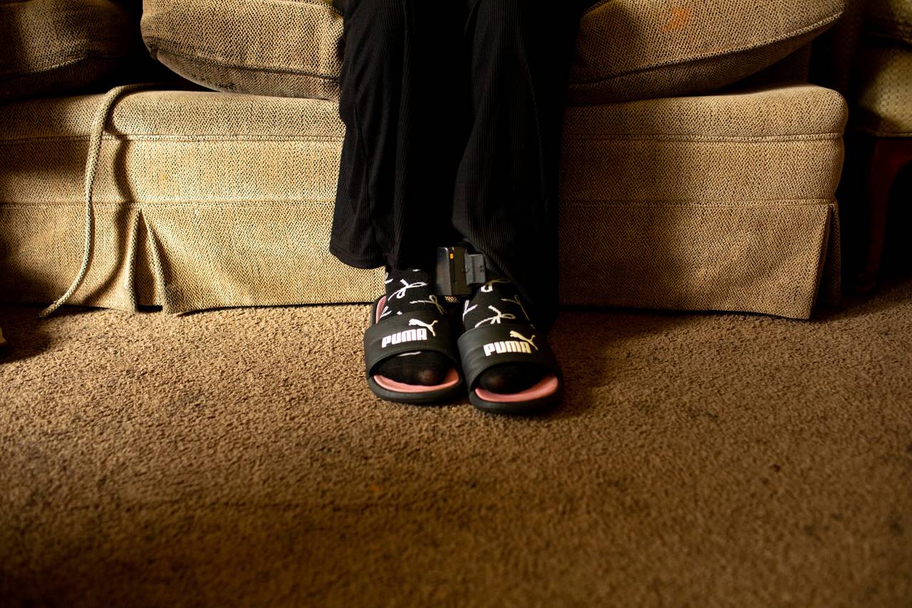Andrea Pedro-Francisco shows the ankle monitor she has to now wear in the Burnsville apartment she lives in with her mother and young siblings Wednesday, July 1, 2026.