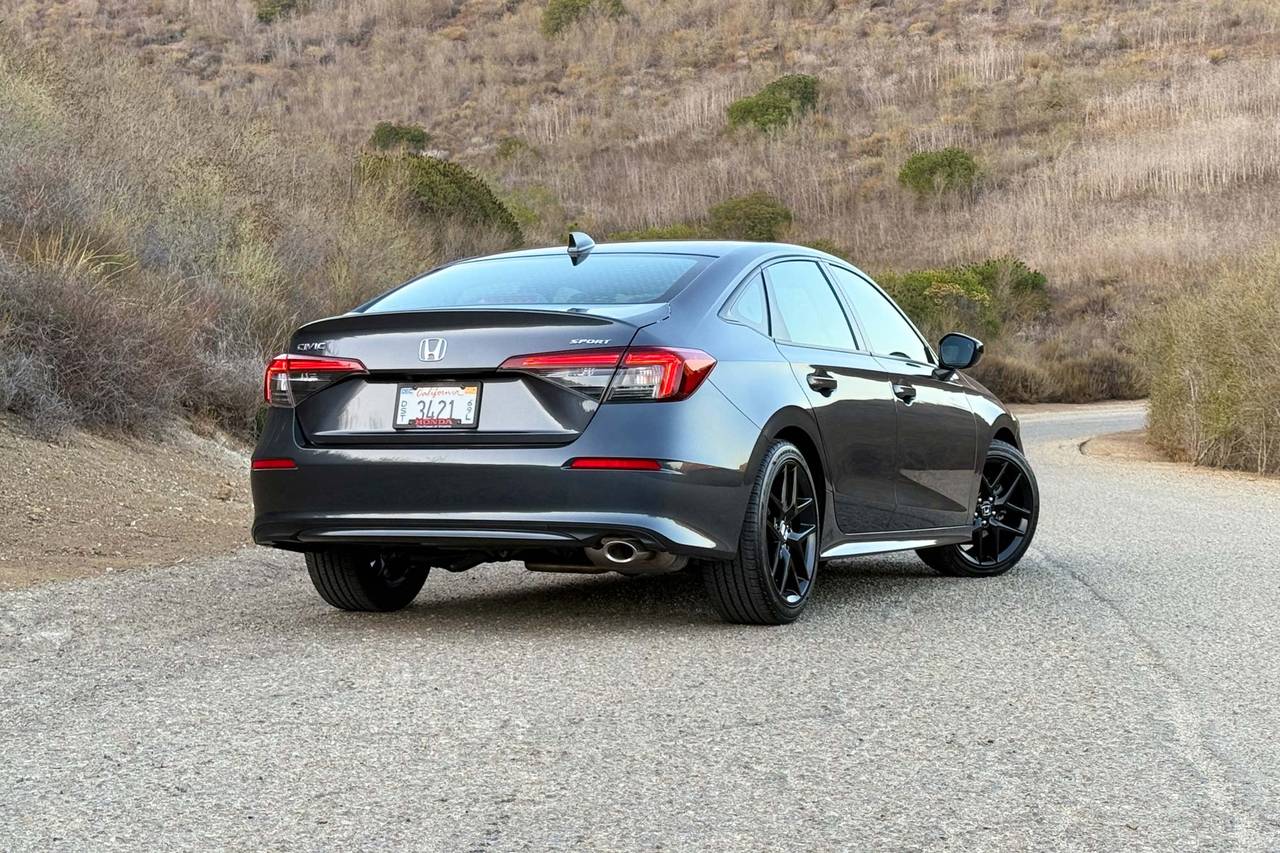 Rear three-quarter view of a 2026 Honda Civic sedan.