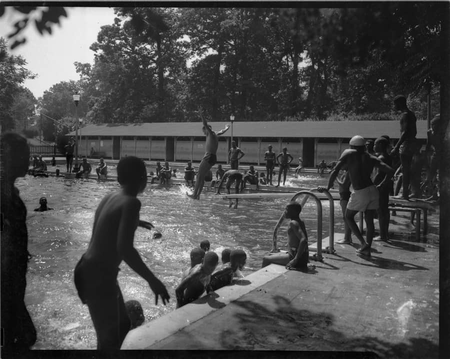 Children and adults swimming at Pool No. 2 located in Druid Hill Park in Baltimore, Maryland. Built in 1921 to segregate recreational activities in Druid Hill Park, this was the only public pool open to Black residents in Baltimore.