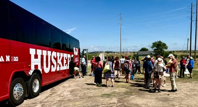 A Lincoln bus arrives at rally site protesting Trump Administration’s mass deportation movement that includes new migrant detention centers such as one in McCook.