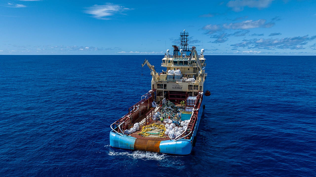 An interceptor model cleans up trash in the ocean.