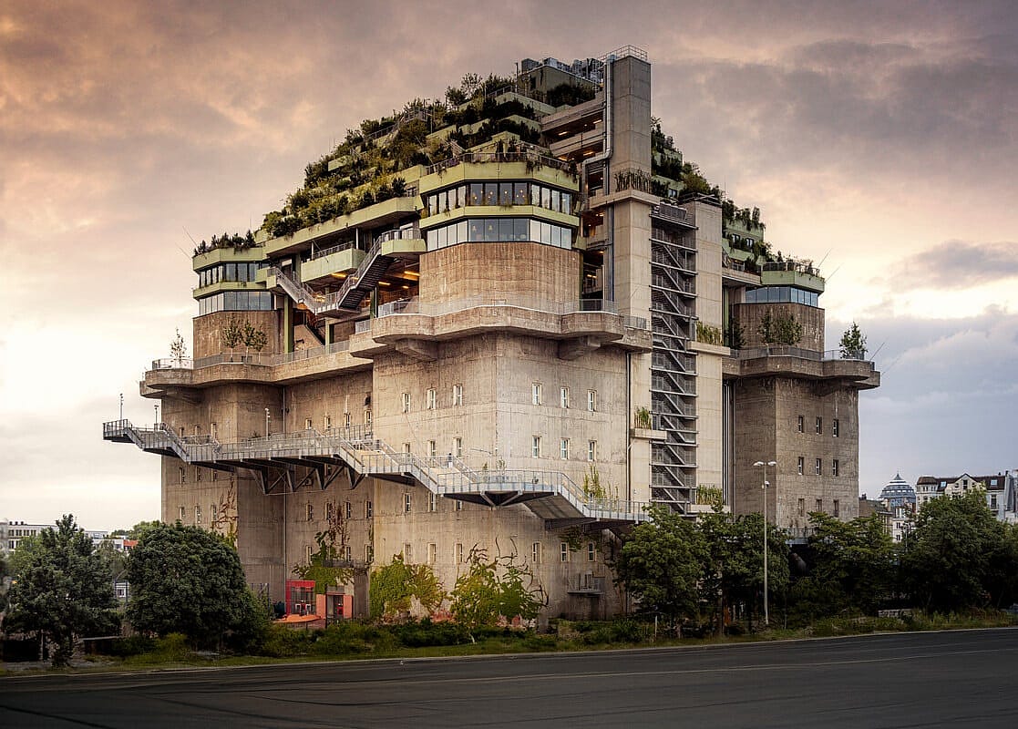 Extrerior view of Hamburg Bunker building, a large World War 2-era concrete bunker that has been transformed into a hotel and event space with rooftop garden.