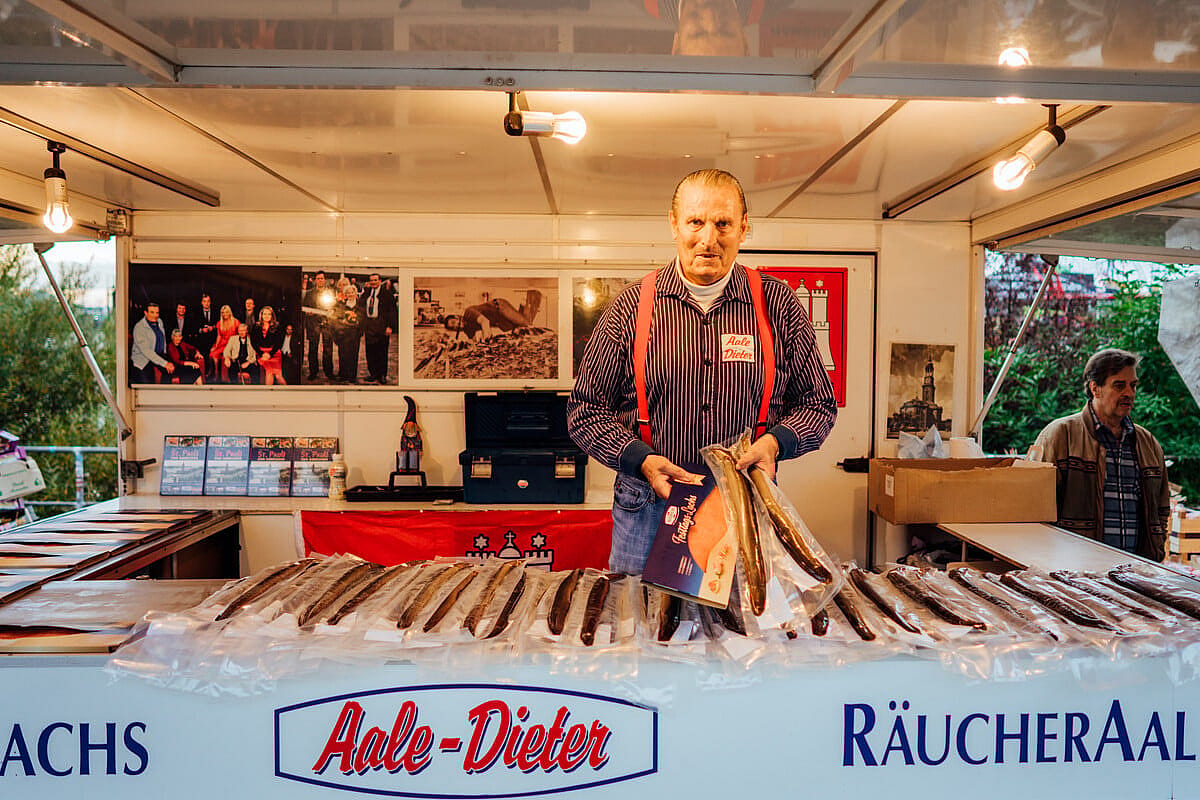 Vendor at the Hamburg Fish market poses with packaged fish.