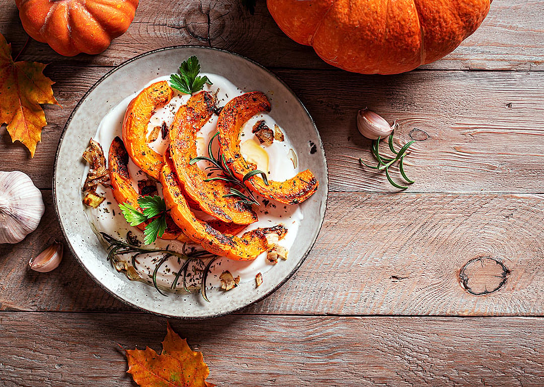 A roasted pumpkin with greek yogurt dish.