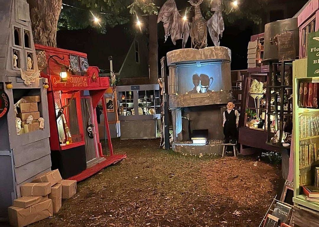 A lawn display in Old East Dallas, Texas with a Harry Potter theme showing storefronts from Diagon Alley.