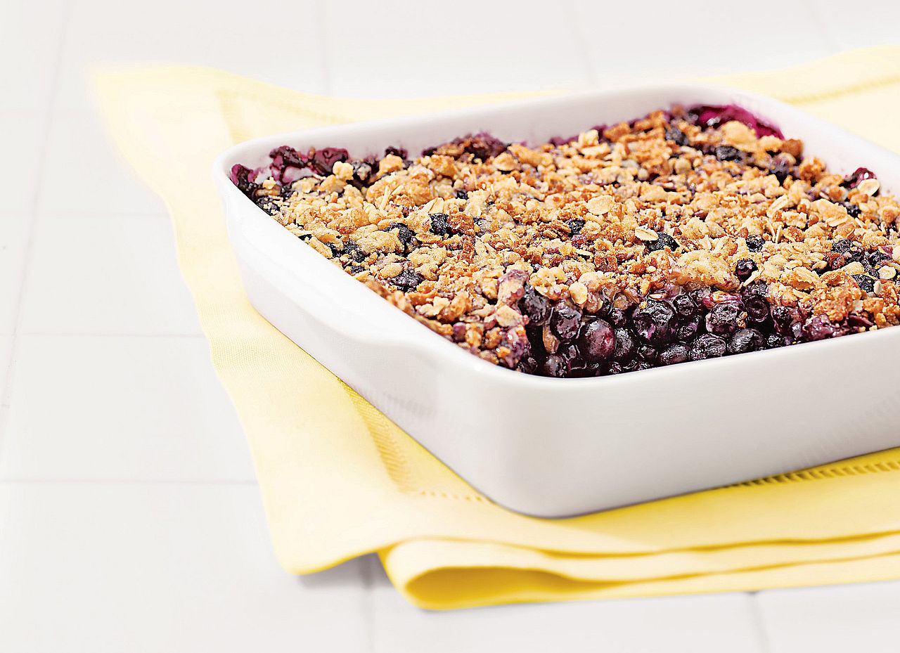 A dish of freshly baked blueberry crisp pie 