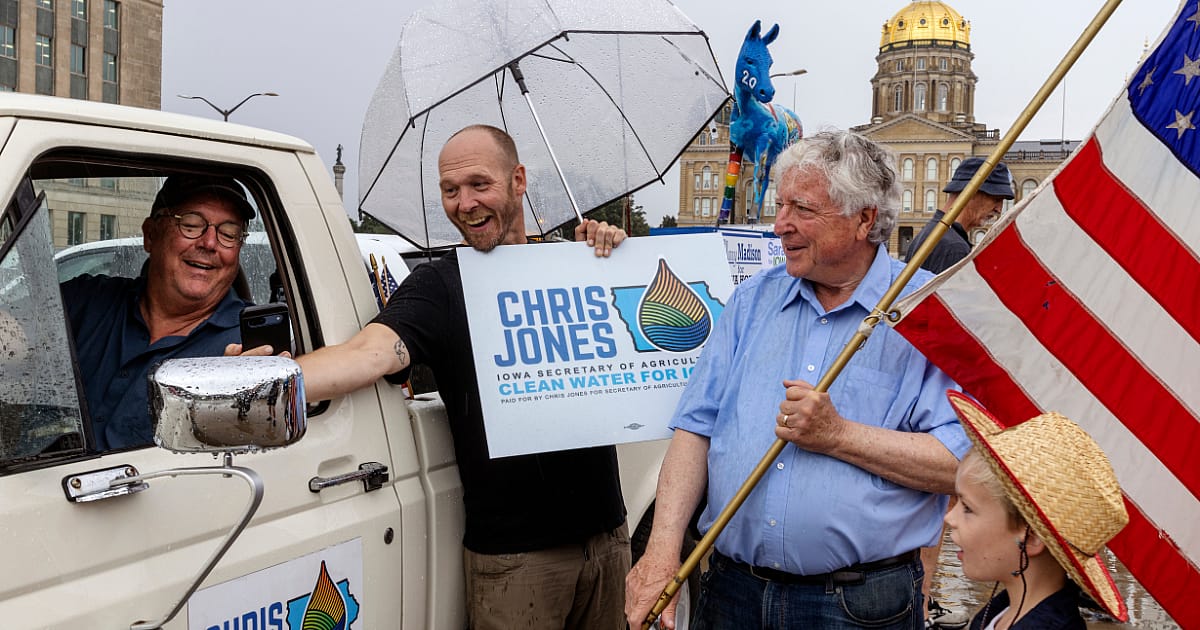 Chris Jones (left) joins a Des Moines, Iowa Labor Day parade in September.
