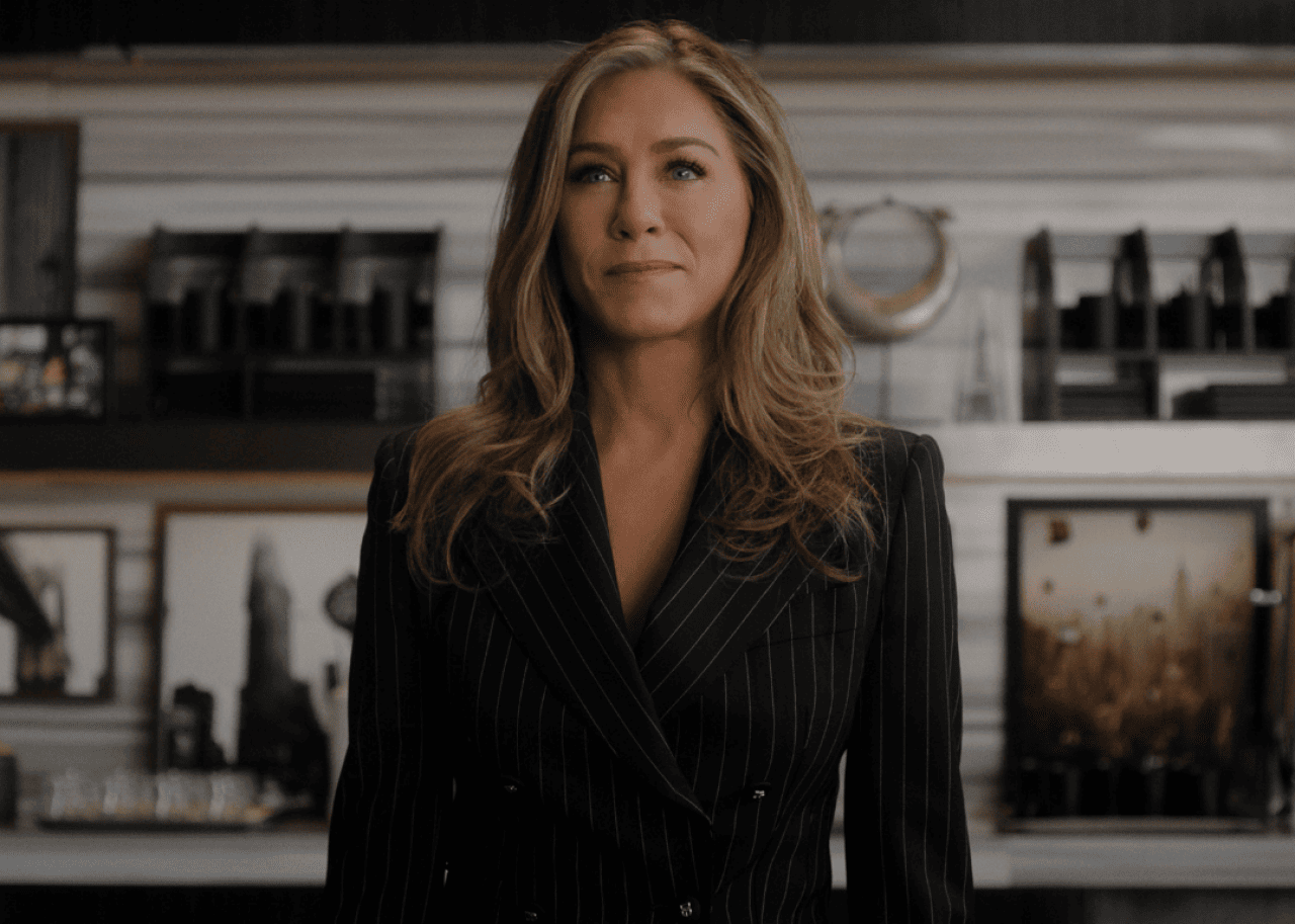 Jennifer Aniston in a pinstripe suit.
