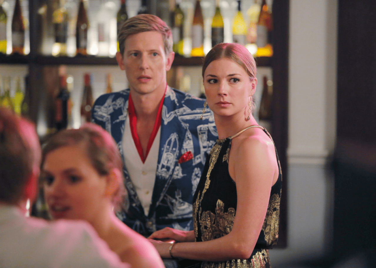 Gabriel Mann and Emily VanCamp at a bar.