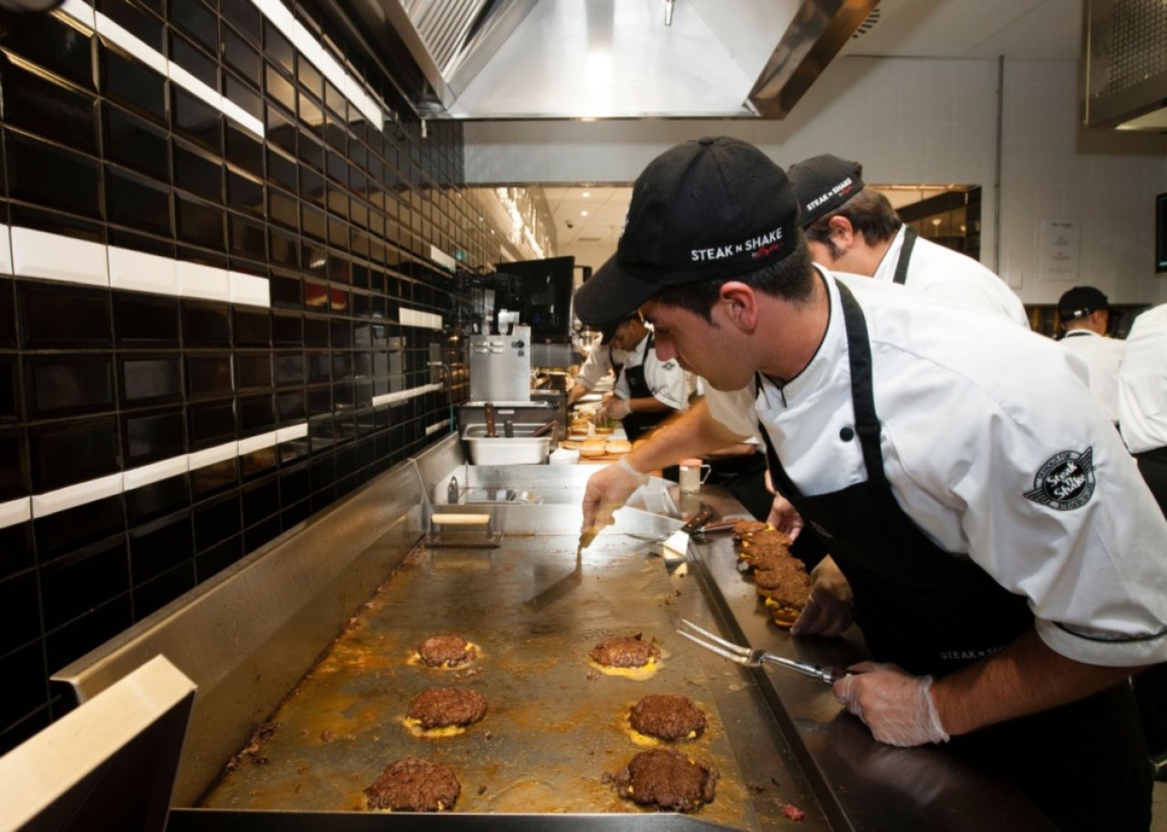 Steak 'n Shake: Butter Double Steakburger Cooks grilling burgers at Steak 'n Shake.
