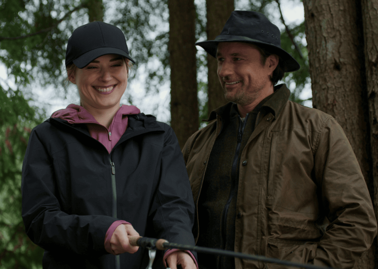 Martin Henderson and Alexandra Breckenridge fishing.