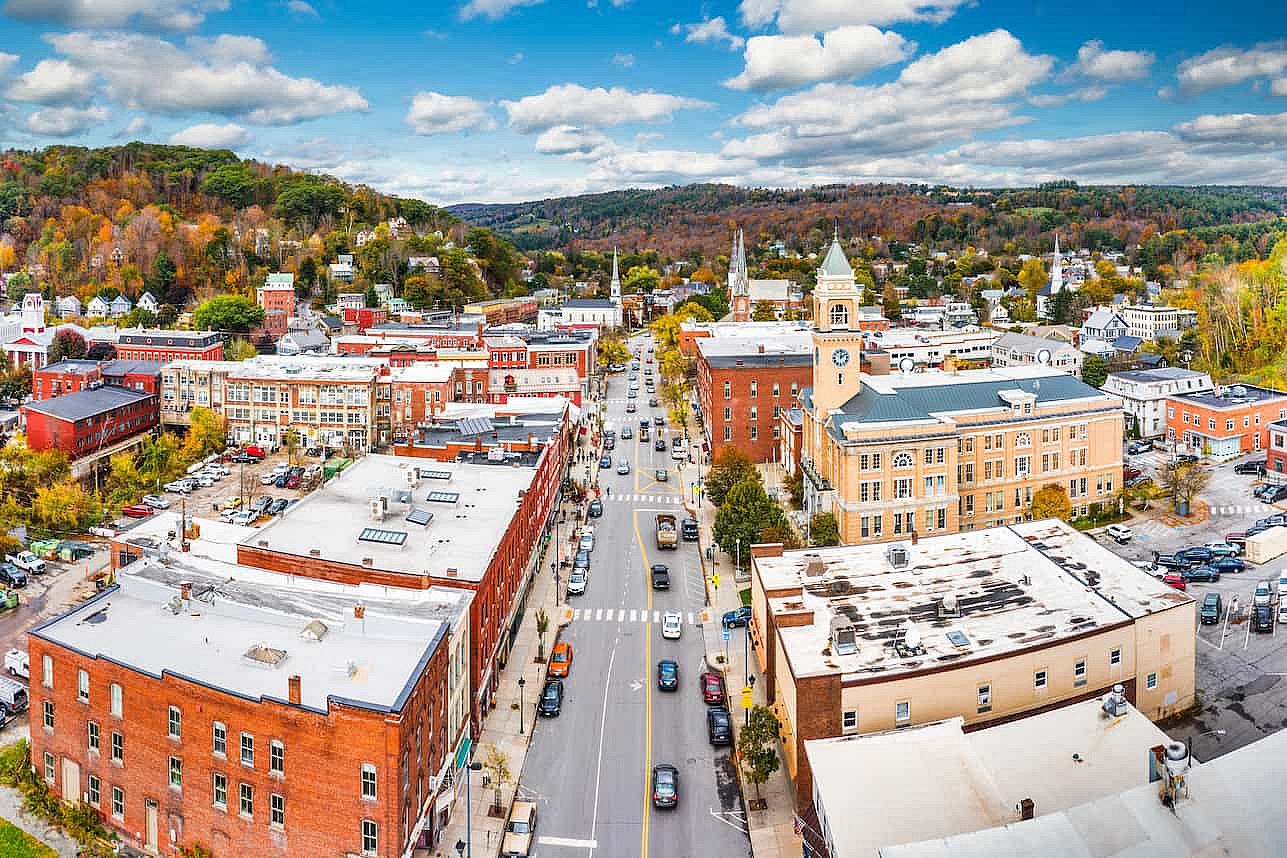 Aerial view of Montpelier, VT cityscape along Main Street on a sunny day with fall foliage colors. Montpelier is the capital of the U.S. state of Vermont and the county seat of Washington County.