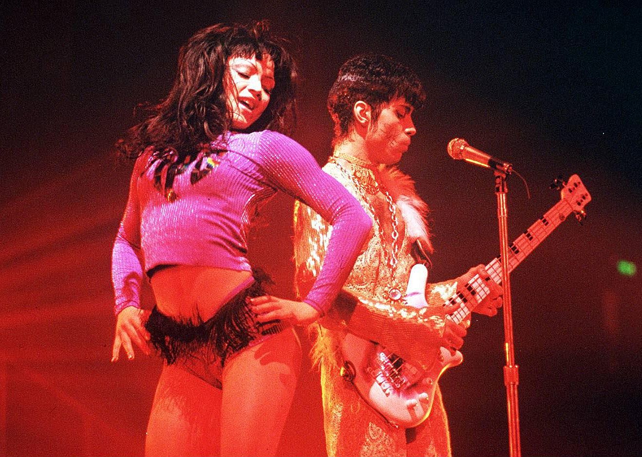 Prince with Mayte Garcia onstage.