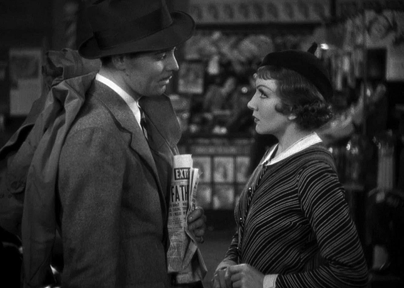 A man and woman look into each other's eyes.